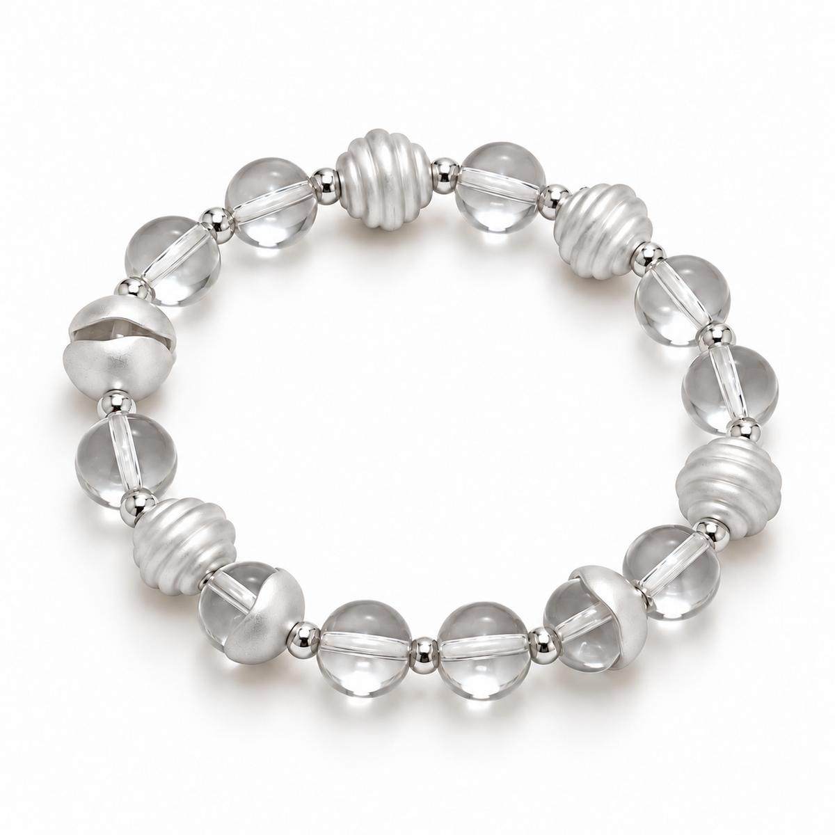 Angled view of the clear quartz bracelet showing ribbed and curved metal accents
