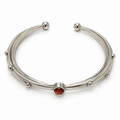 Ember Trace Cuff in electroplated alloy with cognac-red synthetic stone, top view